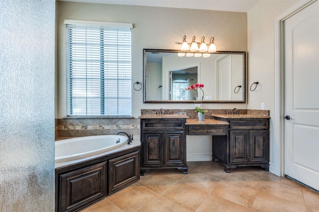 full bathroom with tile patterned flooring, a garden tub, double vanity, and a sink