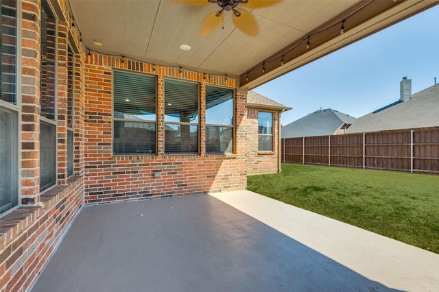 view of patio / terrace featuring a ceiling fan and fence