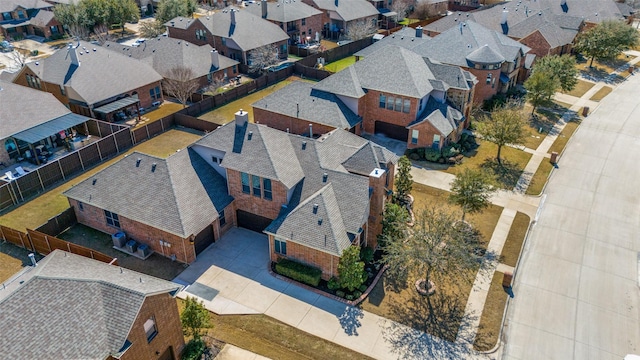 birds eye view of property with a residential view