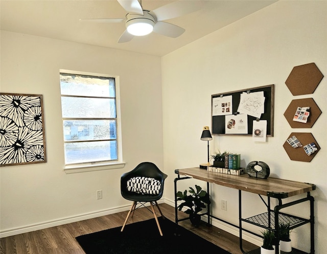 office space featuring ceiling fan, baseboards, and wood finished floors
