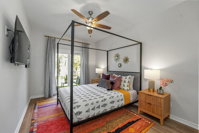 bedroom with baseboards, wood finished floors, and a ceiling fan