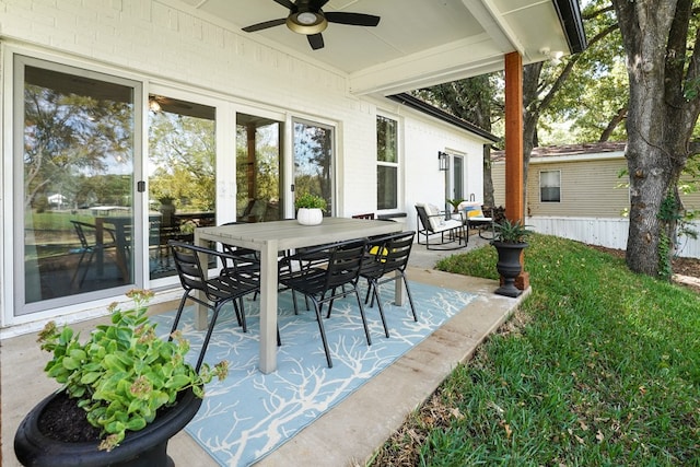 view of patio featuring outdoor dining space and a ceiling fan