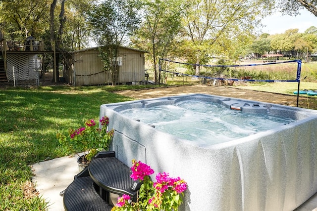 view of yard featuring an outbuilding and a hot tub