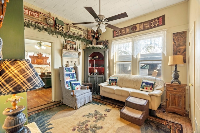 living area featuring ceiling fan