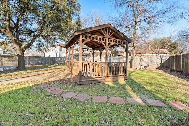 exterior space featuring a fenced backyard and a gazebo