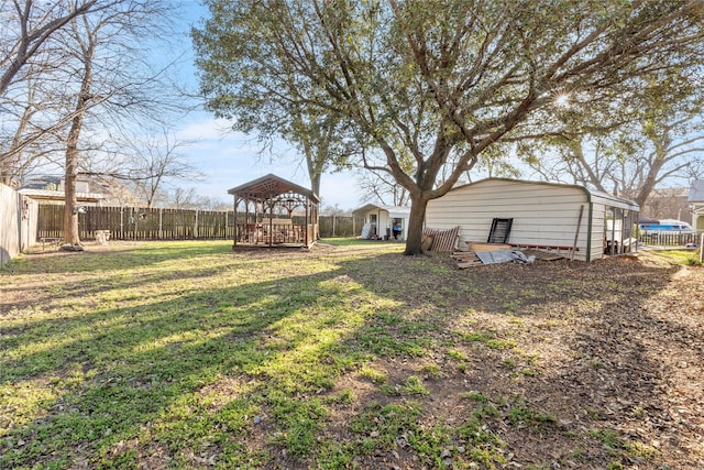 view of yard featuring a gazebo and fence