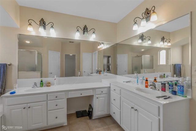 full bath featuring vanity, a stall shower, and tile patterned flooring