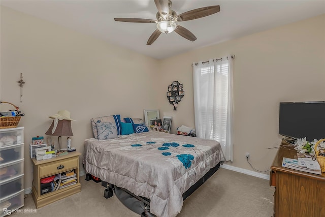 bedroom with baseboards, carpet, and a ceiling fan