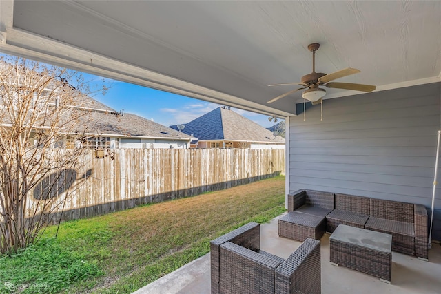 view of patio / terrace featuring an outdoor hangout area, fence, and ceiling fan