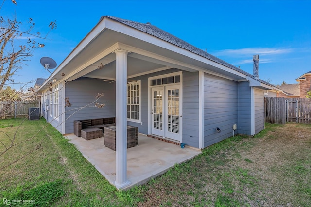 back of house with a yard, a patio area, and a fenced backyard