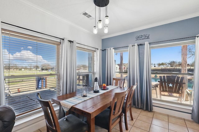 dining area featuring light tile patterned floors, visible vents, and crown molding