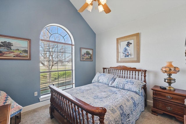 carpeted bedroom featuring high vaulted ceiling, a ceiling fan, and baseboards