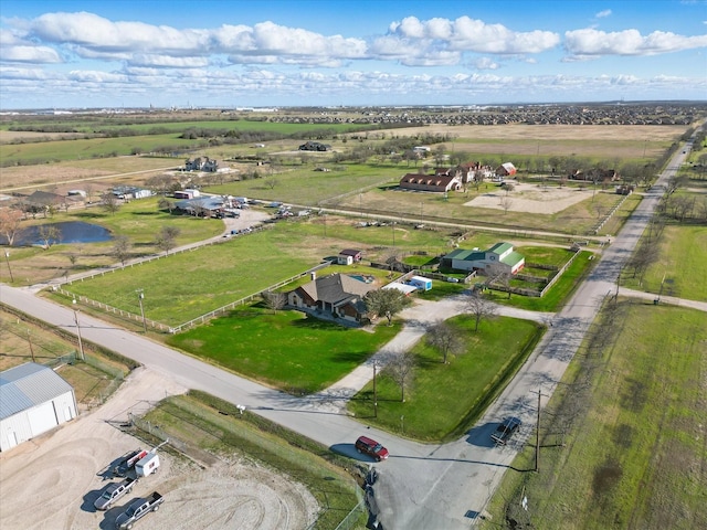 birds eye view of property with a rural view