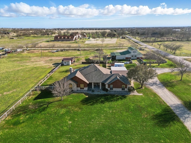 birds eye view of property with a rural view