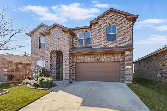 traditional-style house featuring brick siding, an attached garage, concrete driveway, and a front yard