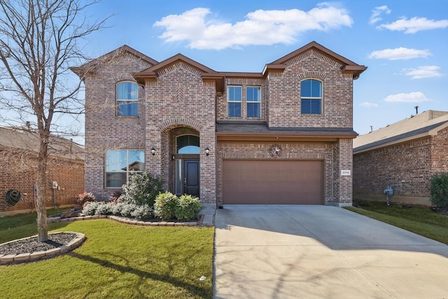 traditional home featuring a garage, a front yard, concrete driveway, and brick siding