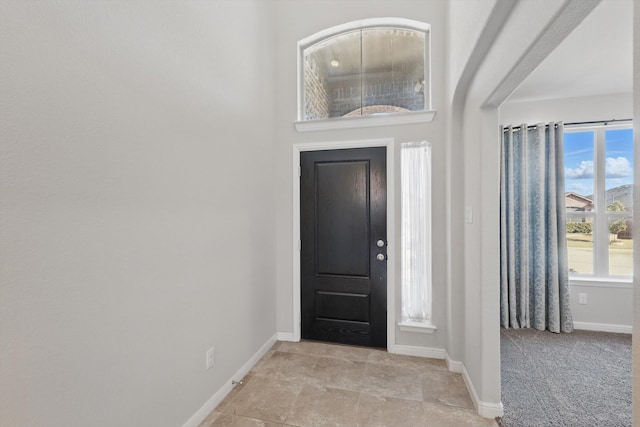 foyer entrance with baseboards