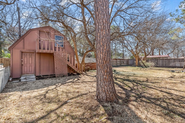 view of yard with an outbuilding and a fenced backyard