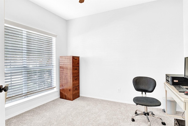 home office with carpet, baseboards, and ceiling fan