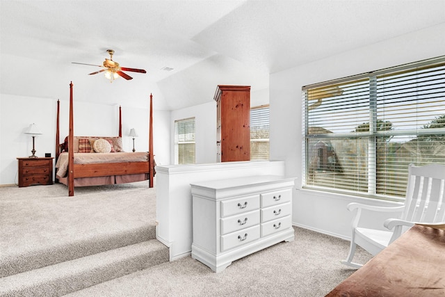 bedroom featuring visible vents, ceiling fan, baseboards, carpet, and vaulted ceiling