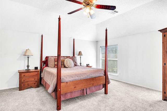 bedroom featuring visible vents, ceiling fan, lofted ceiling, carpet floors, and a textured ceiling