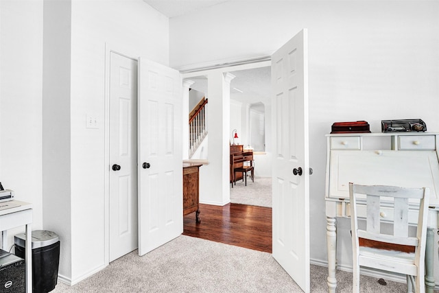 interior space with baseboards and carpet flooring