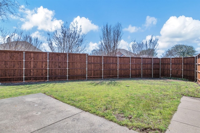 view of yard featuring a patio area and a fenced backyard