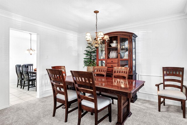 carpeted dining room with an inviting chandelier and crown molding