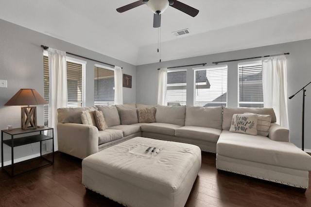 living area featuring dark wood-style floors, visible vents, a ceiling fan, and lofted ceiling