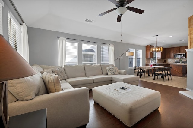 living room featuring visible vents, lofted ceiling, recessed lighting, ceiling fan, and light wood-style floors