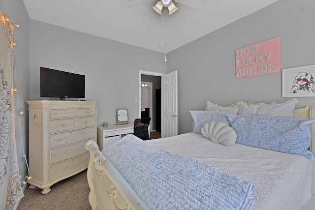 bedroom with a ceiling fan and carpet flooring