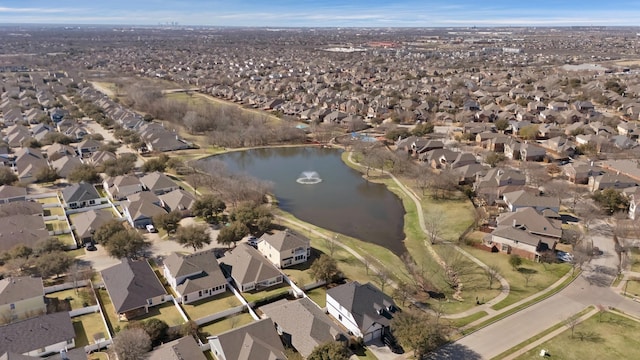 drone / aerial view featuring a residential view and a water view