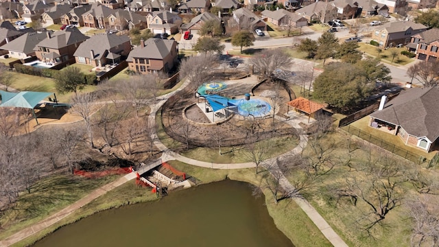 bird's eye view featuring a residential view and a water view