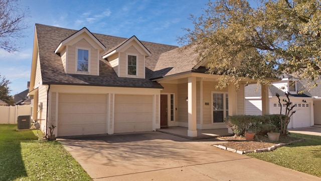 view of front of house featuring concrete driveway, cooling unit, a garage, and roof with shingles