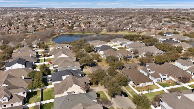 aerial view featuring a residential view and a water view