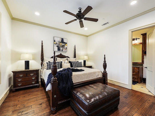 bedroom with visible vents, crown molding, baseboards, and wood finished floors