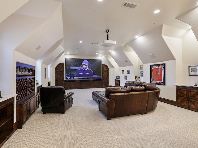 home theater featuring recessed lighting, visible vents, light colored carpet, and lofted ceiling