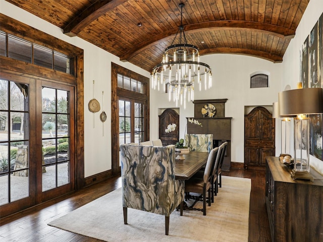 dining room with vaulted ceiling with beams, french doors, baseboards, and wood-type flooring