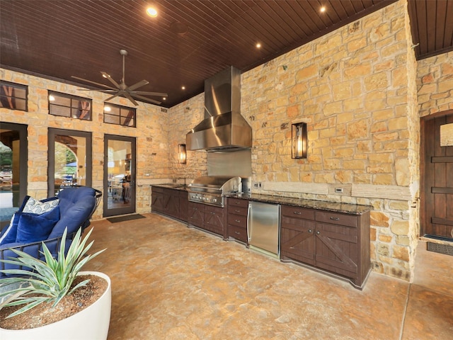 view of patio featuring area for grilling and ceiling fan