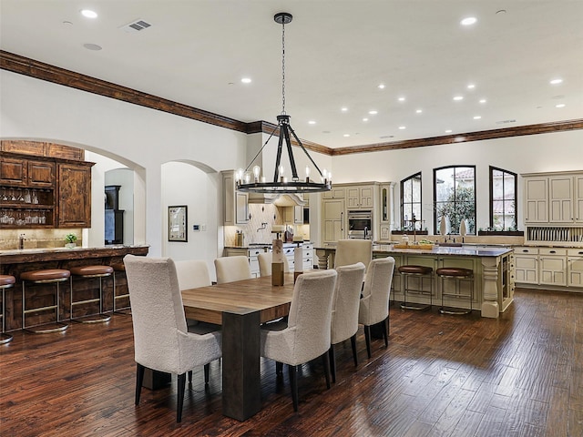 dining area with recessed lighting, visible vents, dark wood-style floors, and crown molding