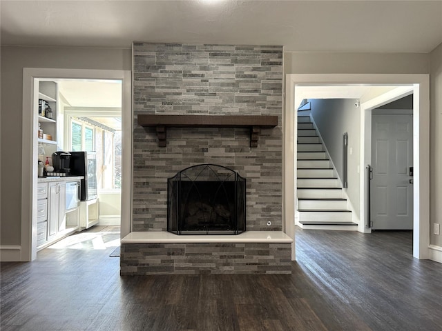 3200 Dover Dr, Plano, TX 75075 - unfurnished living room with wood finished floors, stairs, and a fireplace