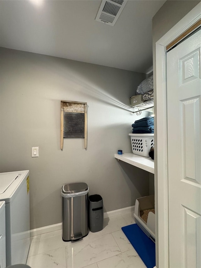 3200 Dover Dr, Plano, TX 75075 - laundry room featuring washing machine and clothes dryer and marble look tile flooring