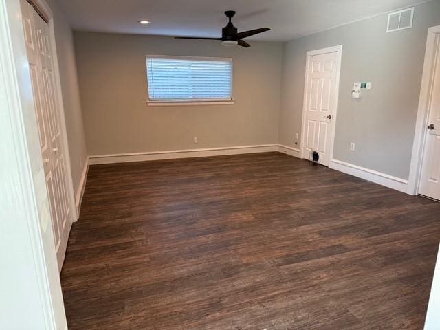 3200 Dover Dr, Plano, TX 75075 - unfurnished bedroom featuring dark wood-style flooring and a ceiling fan
