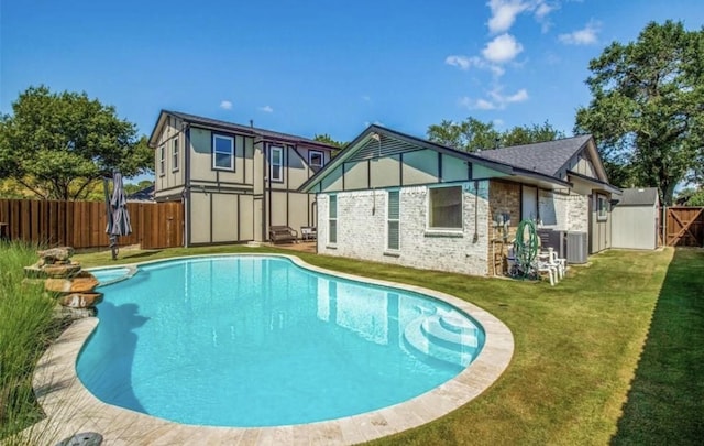 3200 Dover Dr, Plano, TX 75075 - rear view of property featuring a fenced backyard, brick siding, and a pool with connected hot tub