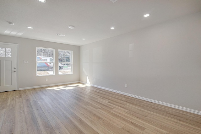 3231 Comanche St, Fort Worth, TX 76119 - unfurnished room featuring light wood-style flooring, baseboards, visible vents, and a wealth of natural light