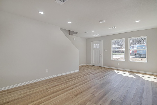 interior space with visible vents, light wood-style flooring, recessed lighting, and baseboards