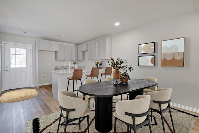 3231 Comanche St, Fort Worth, TX 76119 - dining area featuring recessed lighting, light wood-type flooring, visible vents, and baseboards