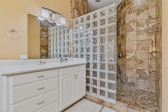 bathroom with vanity and a walk in shower