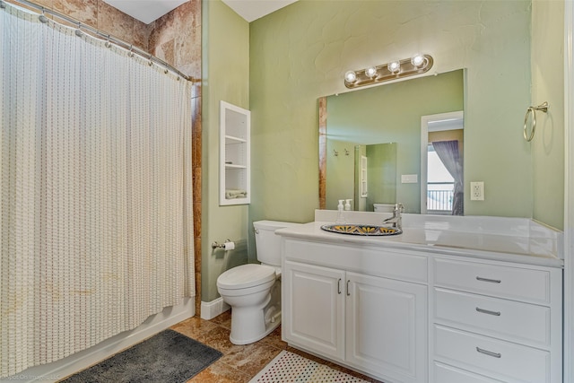 bathroom with tile patterned floors, toilet, shower / tub combo with curtain, and vanity