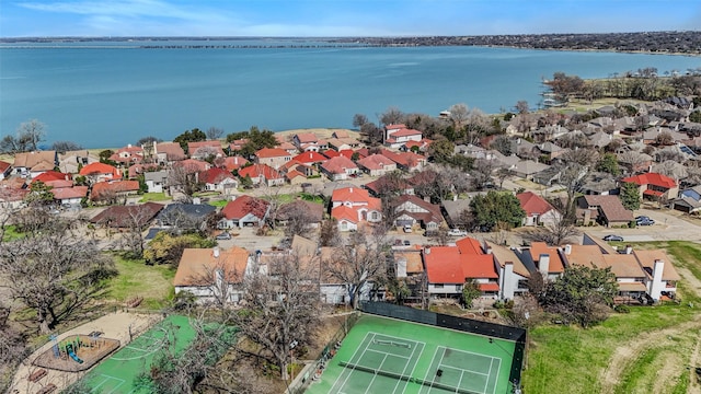 drone / aerial view featuring a residential view and a water view